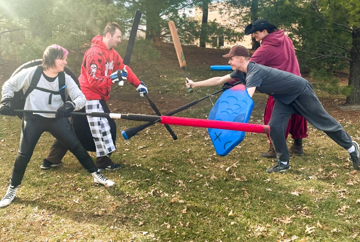 Members of UNIs Swordfighting Club prepare for battle on Lawther Field.