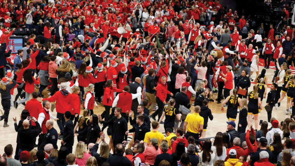 Fans storm the court following Ohio State’s upset win over the Hawkeyes. Caitlin Clark collided with an Ohio state fan in the midst of the storming, calling to question whether storming the court after games should be allowed.