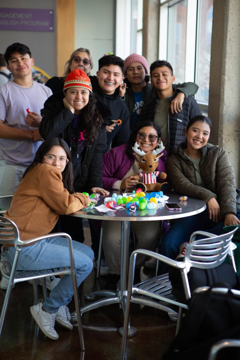 Students+pose+with+their+Easter+goodies+March+30+at+the+OIE+Easter+egg+hunt.