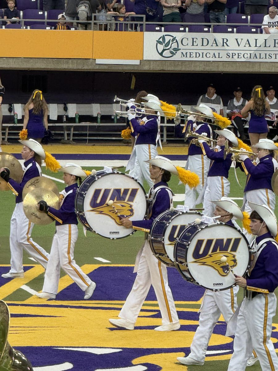 Tyler Schuur plays bass line in the Panther Marching Band.