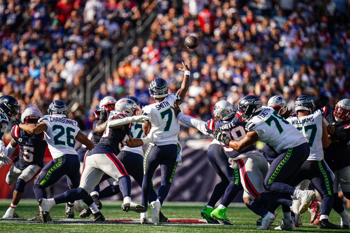 Seattle Seahawks player throws a pass against the New England Patriots in overtime at Gillette Stadium.